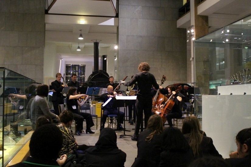 A group of musicians performs for primary school students