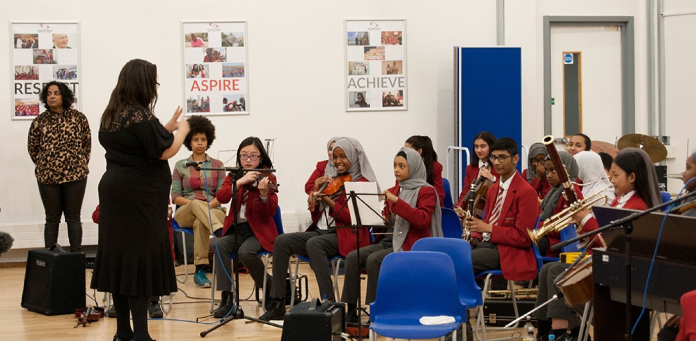 Swanlea students perform as a small orchestra
